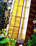 House Of Paramya pea green and violet tiny check cotton Kasavu saree with a traditional golden border and tassels.