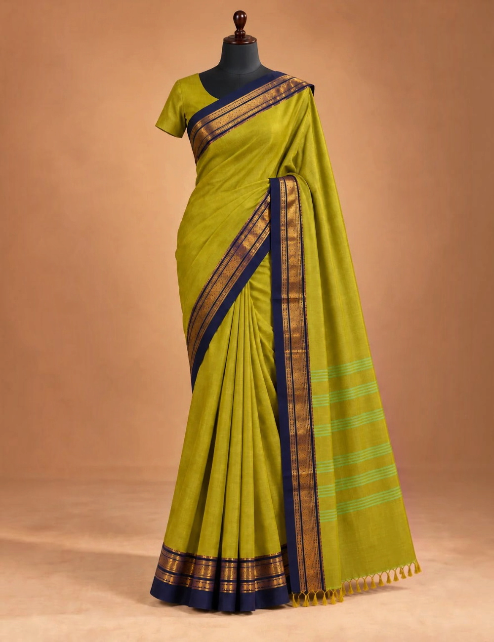 House Of Paramya olive green Chettinad cotton saree with navy blue gold zari border and striped pallu on a mannequin