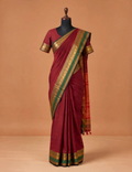 House Of Paramya maroon Chettinad cotton saree with a bottle green border featuring antique gold zari peacock motifs.