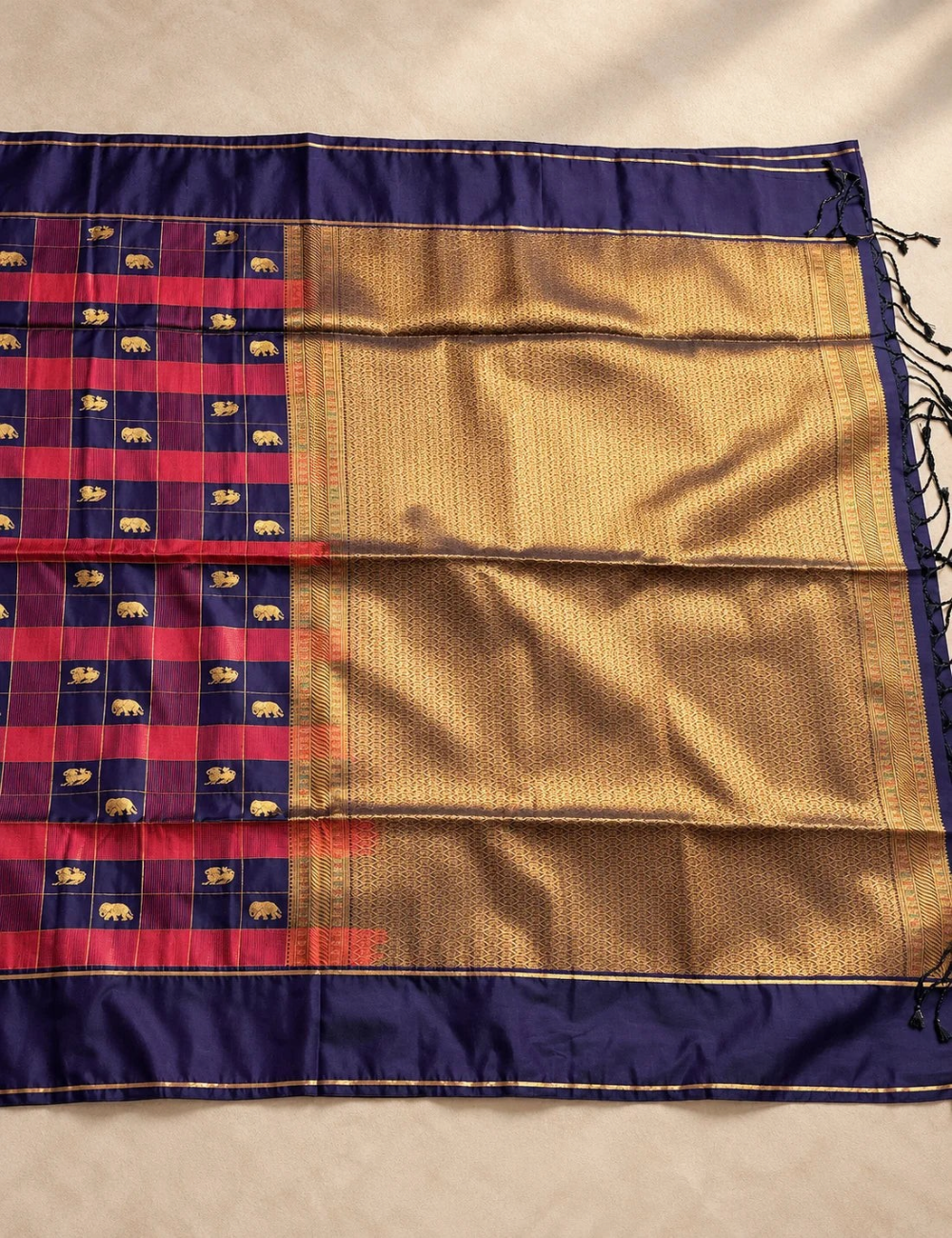 House Of Paramya plum purple soft silk saree featuring teal green checks, gold zari elephant motifs, and gold pallu.