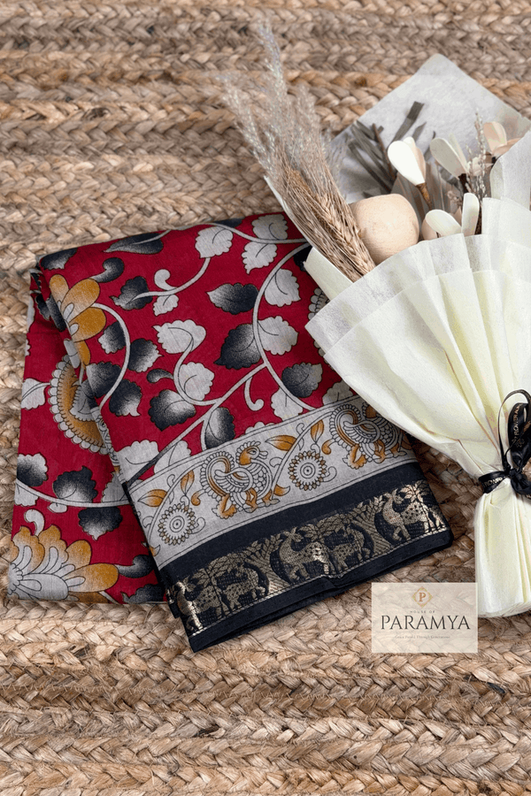 Red Floral Printed Saree front view — black deer zari border on bright red | House of Paramya