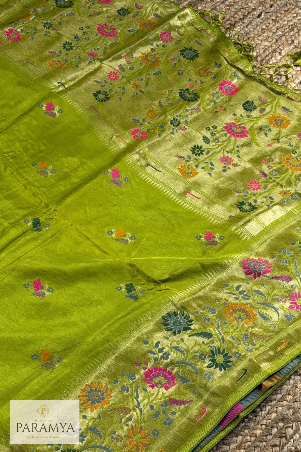 Close-up of multicolour floral weave on gold zari Paithani pallu in parrot green silk saree — House of Paramya