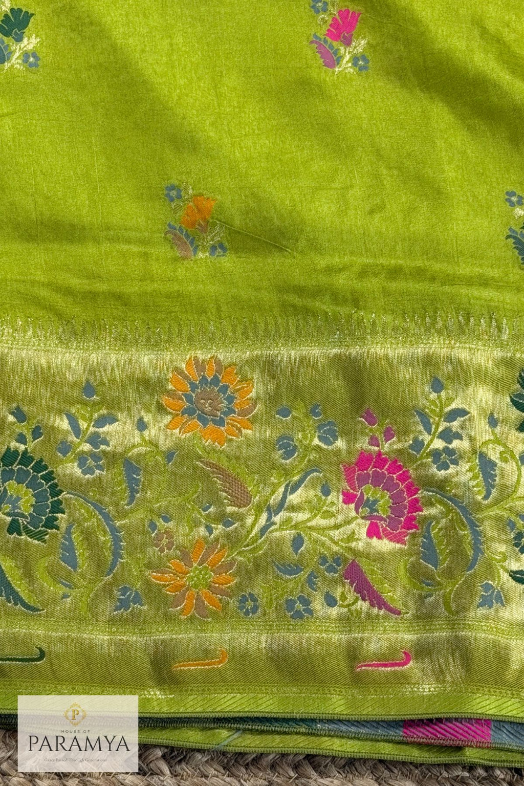 Broad antique gold zari border with intricate woven pattern on parrot green Paithani silk saree — House of Paramya