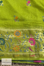 Broad antique gold zari border with intricate woven pattern on parrot green Paithani silk saree — House of Paramya