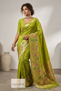 Woman draped in parrot green Paithani silk saree with multicolour floral pallu and gold zari border — House of Paramya PSGM101