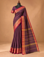 House Of Paramya deep aubergine Chettinad cotton saree with wine and gold zari elephant motif border on a mannequin.