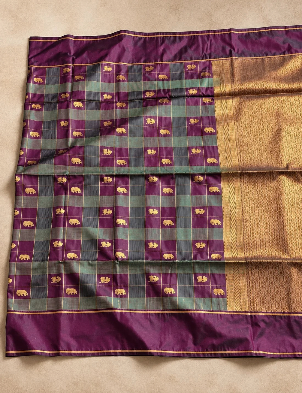 House Of Paramya plum purple and teal green soft silk saree with gold zari elephant motifs and antique gold pallu