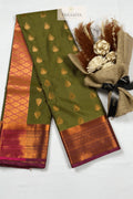 Olive Green Rasipuram Silk Saree with Pink Zari Border - Saree View | House Of Paramya