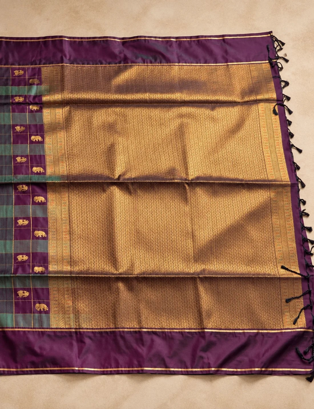 House Of Paramya plum purple soft silk saree with teal green checks, gold zari elephant motifs, and antique gold pallu