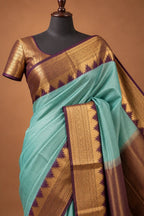 House Of Paramya aqua Mysore crepe silk saree with a purple and gold zigzag temple border and checkered texture.