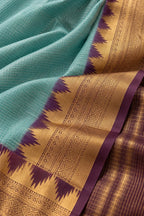 House Of Paramya aqua Mysore crepe silk saree with a purple and gold zigzag temple border and checkered texture.