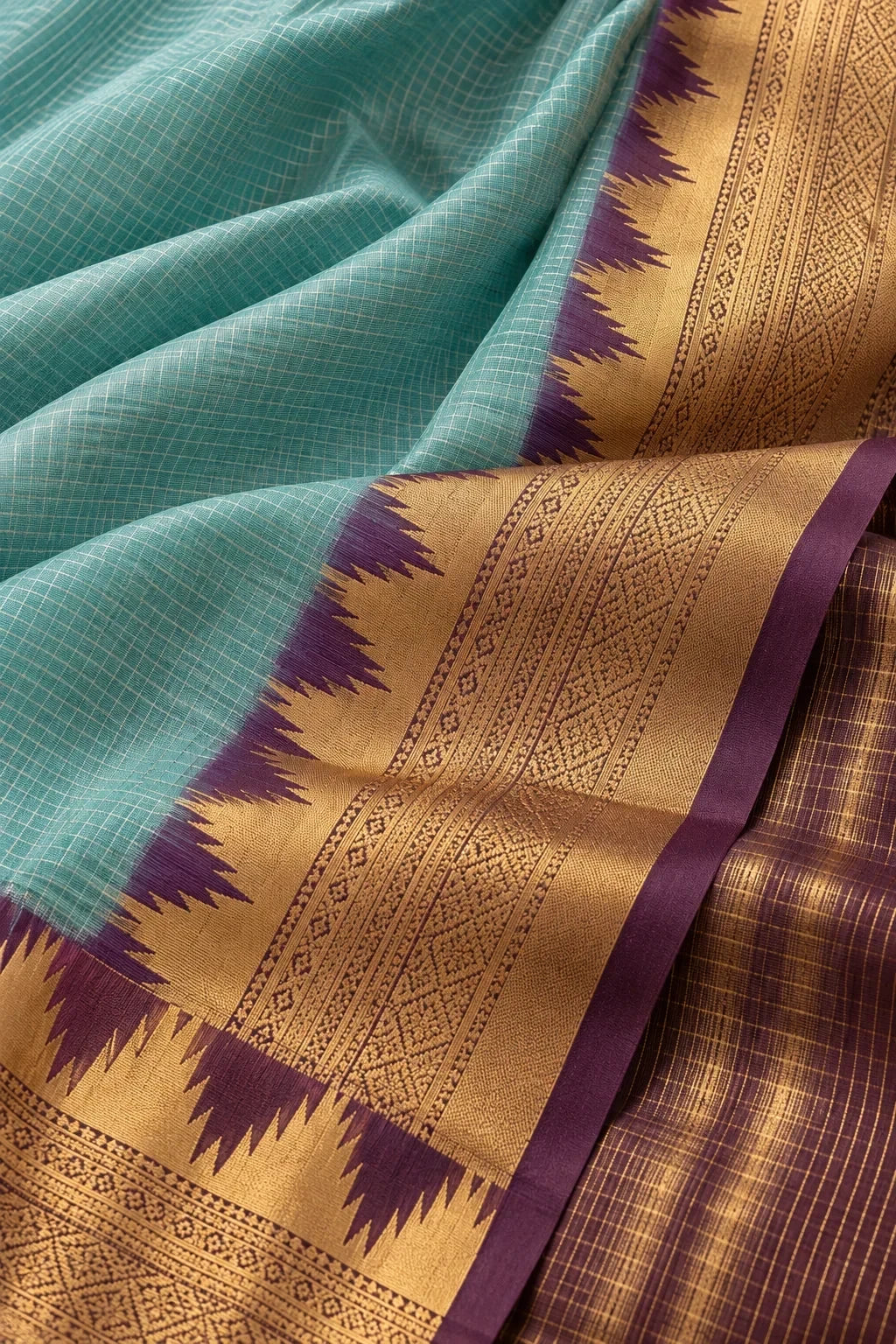 House Of Paramya aqua Mysore crepe silk saree with a purple and gold zigzag temple border and checkered texture.