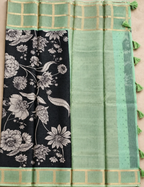 House Of Paramya black soft Kota silk saree with floral print and sage green zari check border and tassel pallu.