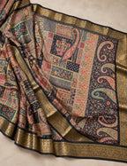 House Of Paramya black georgette saree with multicolor patchwork print, paisley motifs, and gold zari woven border.