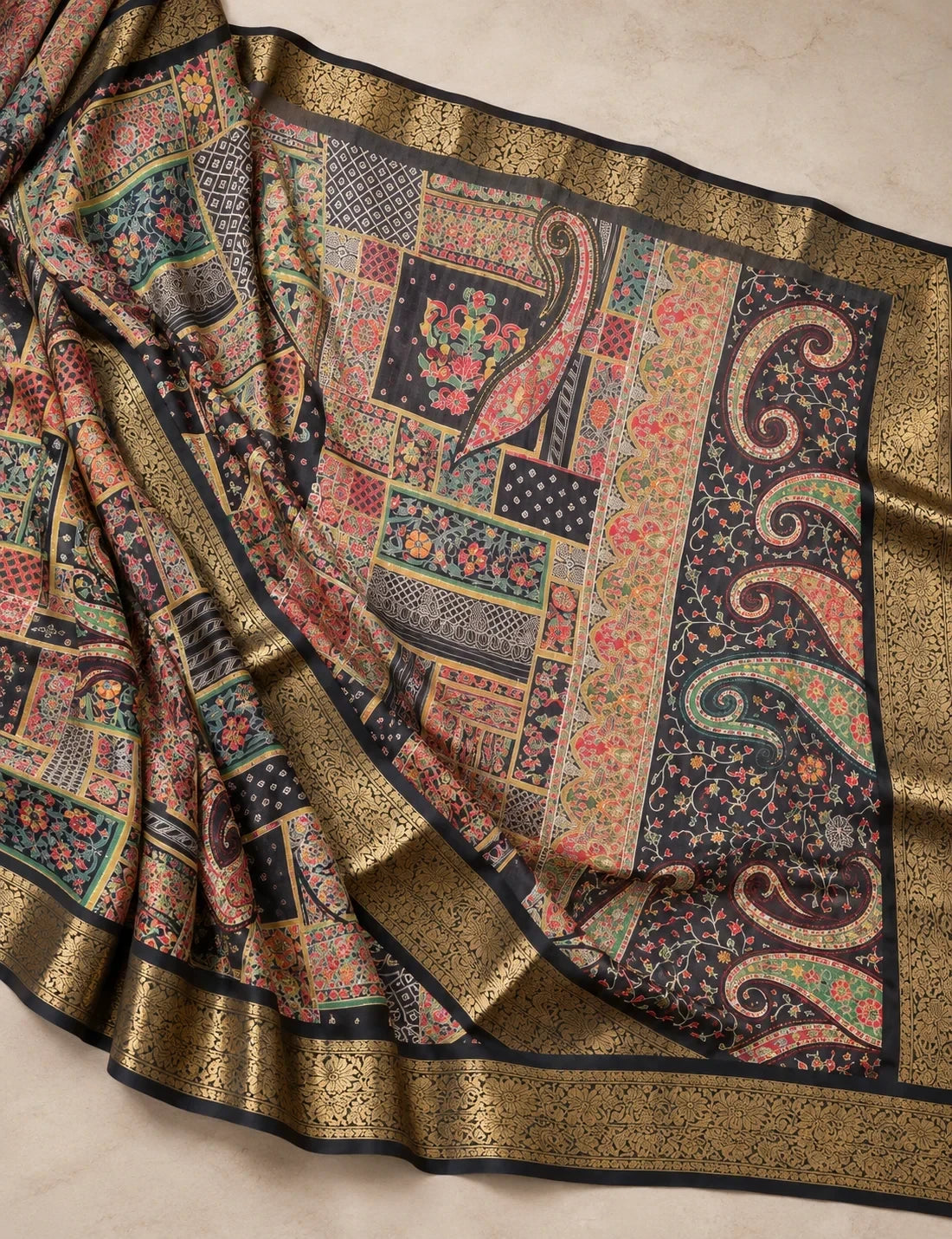 House Of Paramya black georgette saree with multicolor patchwork print, paisley motifs, and gold zari woven border.