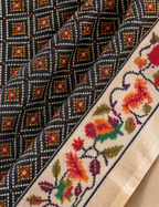 House Of Paramya black silk saree with digital Patola print and a cream border featuring woven parrot motifs