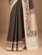 House Of Paramya black silk saree featuring a digital Patola print and a woven parrot motif border with a gold pallu.