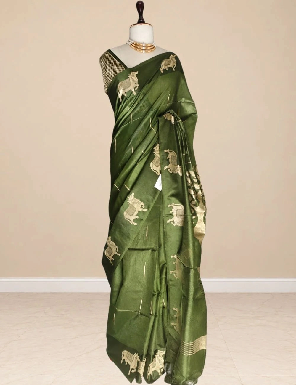 House Of Paramya raw tussar silk saree in dark green with woven gold zari Pichwai cow motifs and striped pallu