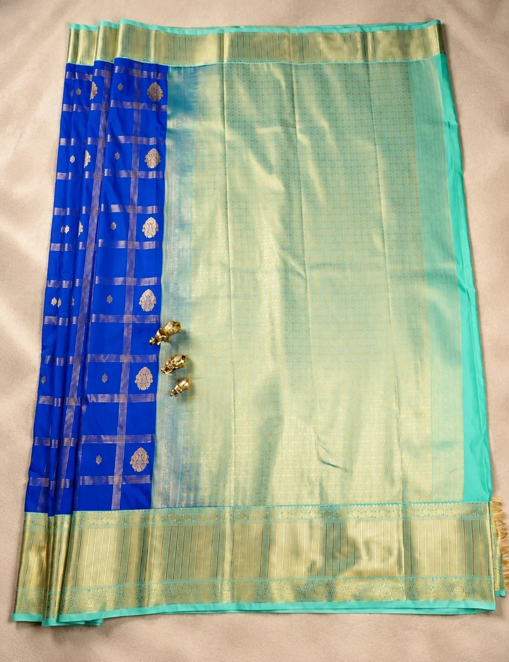 House Of Paramya royal blue semi Kanjivaram silk saree with checkered weave, floral butis and turquoise gold zari border