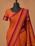 House Of Paramya burnt orange Chettinad cotton saree with a maroon border featuring gold zari rosette and diamond motifs.
