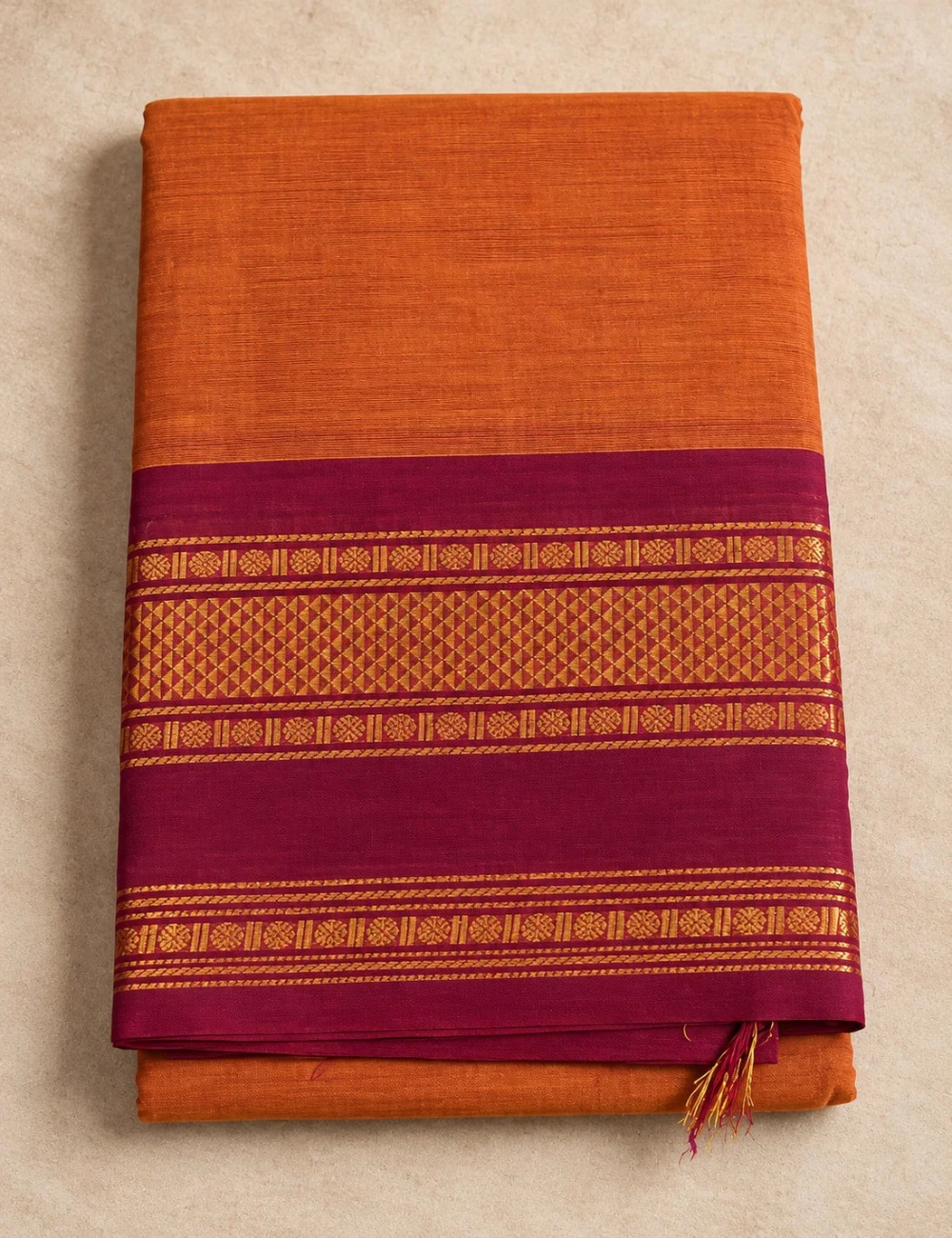 House Of Paramya burnt orange Chettinad cotton saree with a maroon border featuring gold zari rosette and diamond motifs