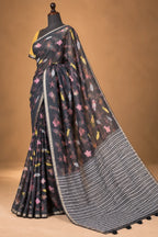 House Of Paramya charcoal linen saree featuring whimsical marine motifs and a black and white chevron striped pallu.