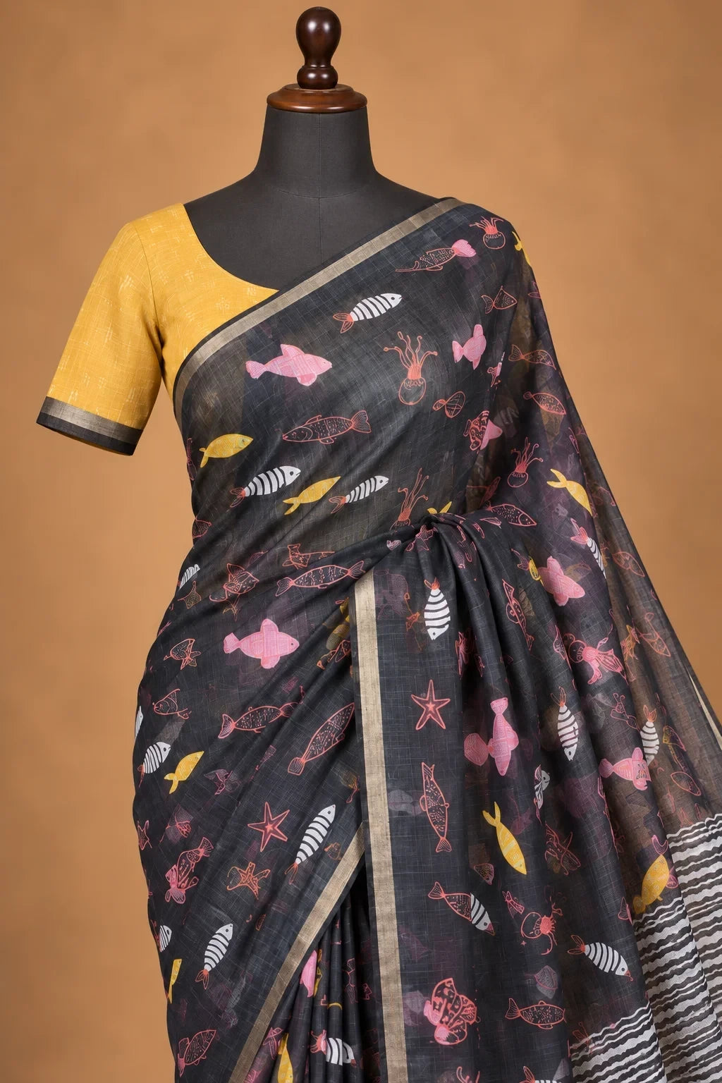 House Of Paramya charcoal linen saree with whimsical marine fish and starfish print, paired with a chevron pallu.