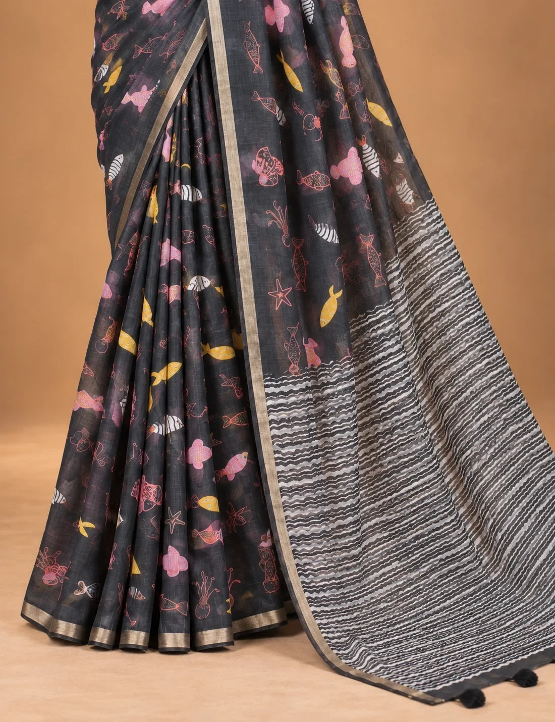 House Of Paramya charcoal linen saree with whimsical marine motifs and a black and white chevron striped pallu.