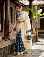 House Of Paramya cream cotton Kasavu saree featuring navy blue Ajrakh elephant print and traditional gold zari border.