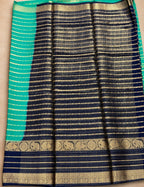 House Of Paramya crepe silk saree featuring navy blue and turquoise green stripes with gold elephant motif borders.