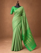 House Of Paramya emerald green Kanchipuram silk saree with a checked pattern and intricate gold zari floral border.