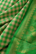 House Of Paramya emerald green Kanchipuram silk saree with a traditional checked pattern and ornate gold zari border.