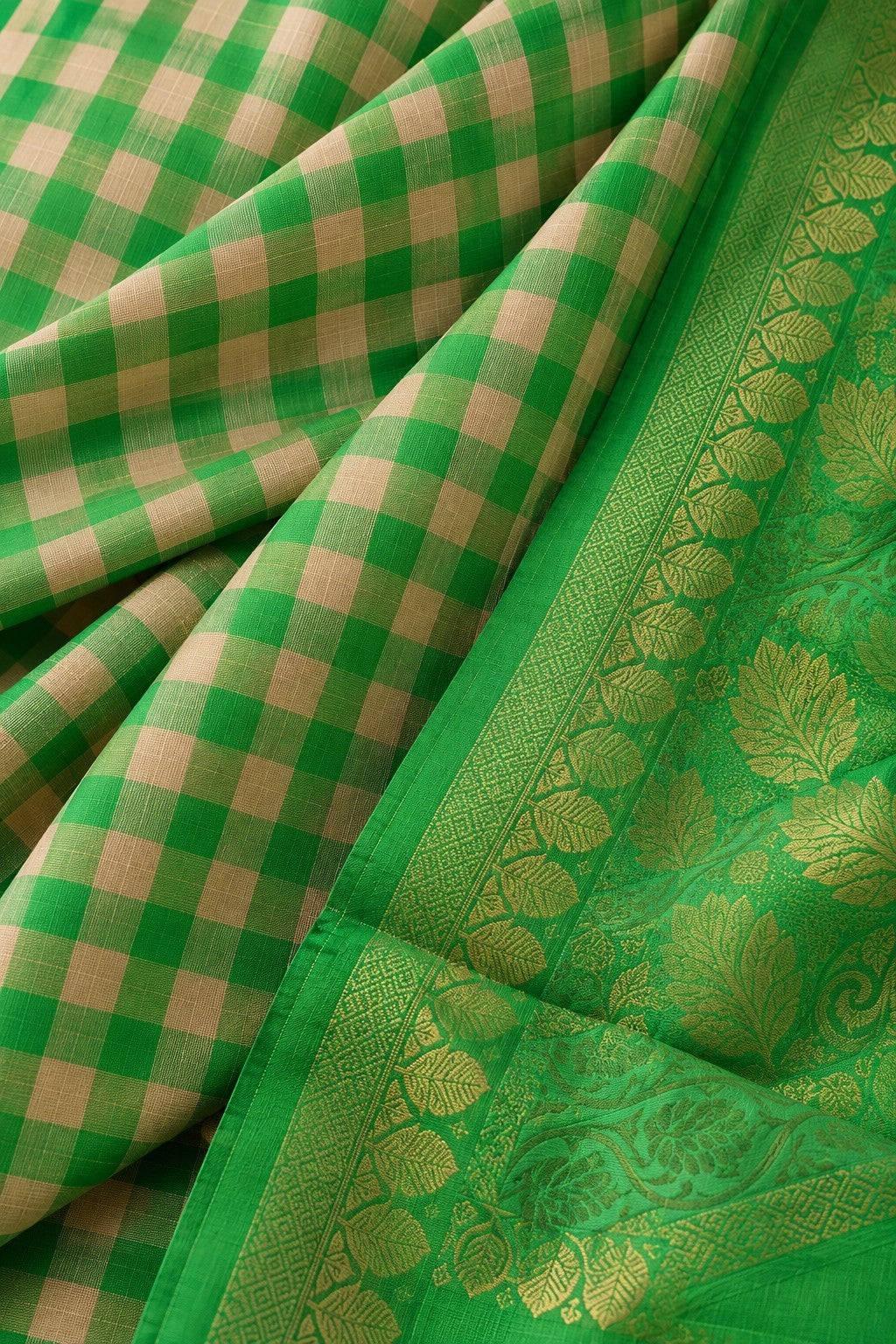 House Of Paramya emerald green Kanchipuram silk saree with a traditional checked pattern and ornate gold zari border.