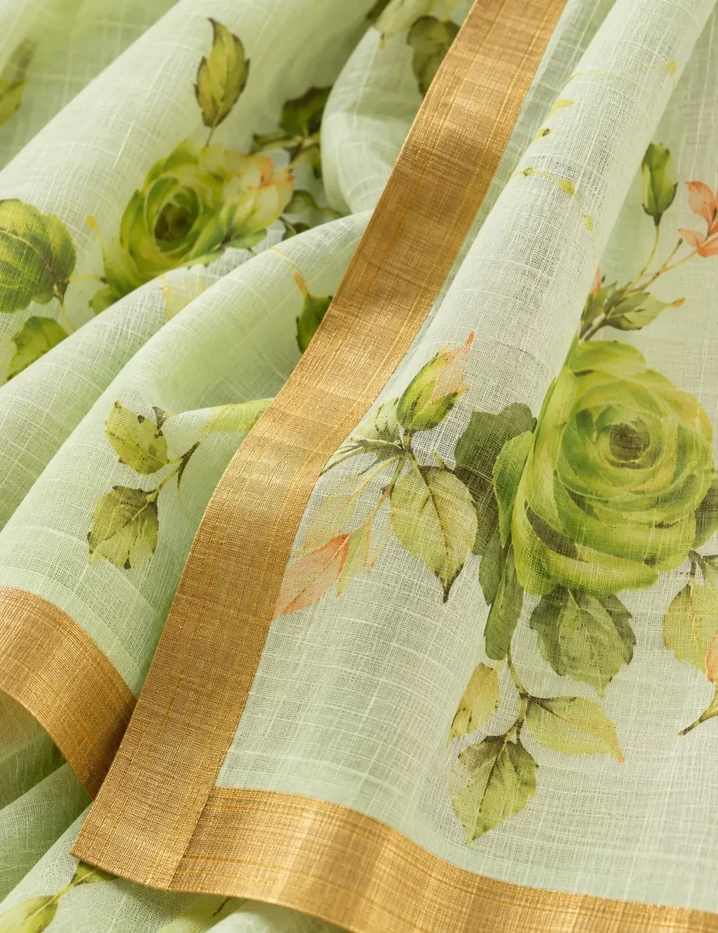 House Of Paramya pastel green linen cotton saree featuring a tonal monochrome rose print and a gold zari border.