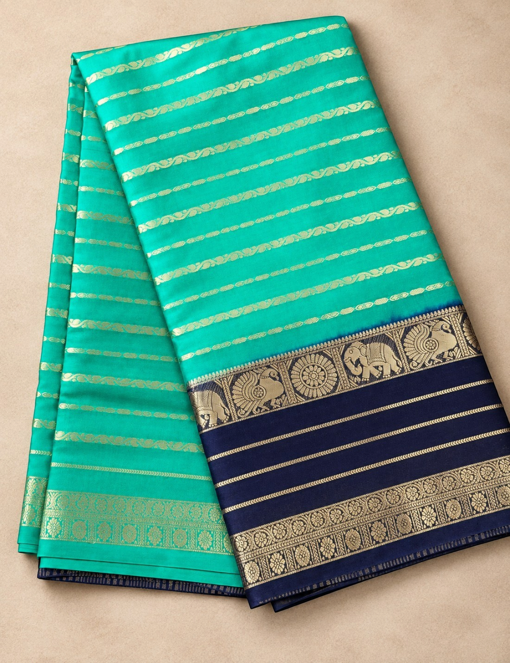 House Of Paramya crepe silk saree in turquoise green and navy blue with intricate gold zari border and striped pattern