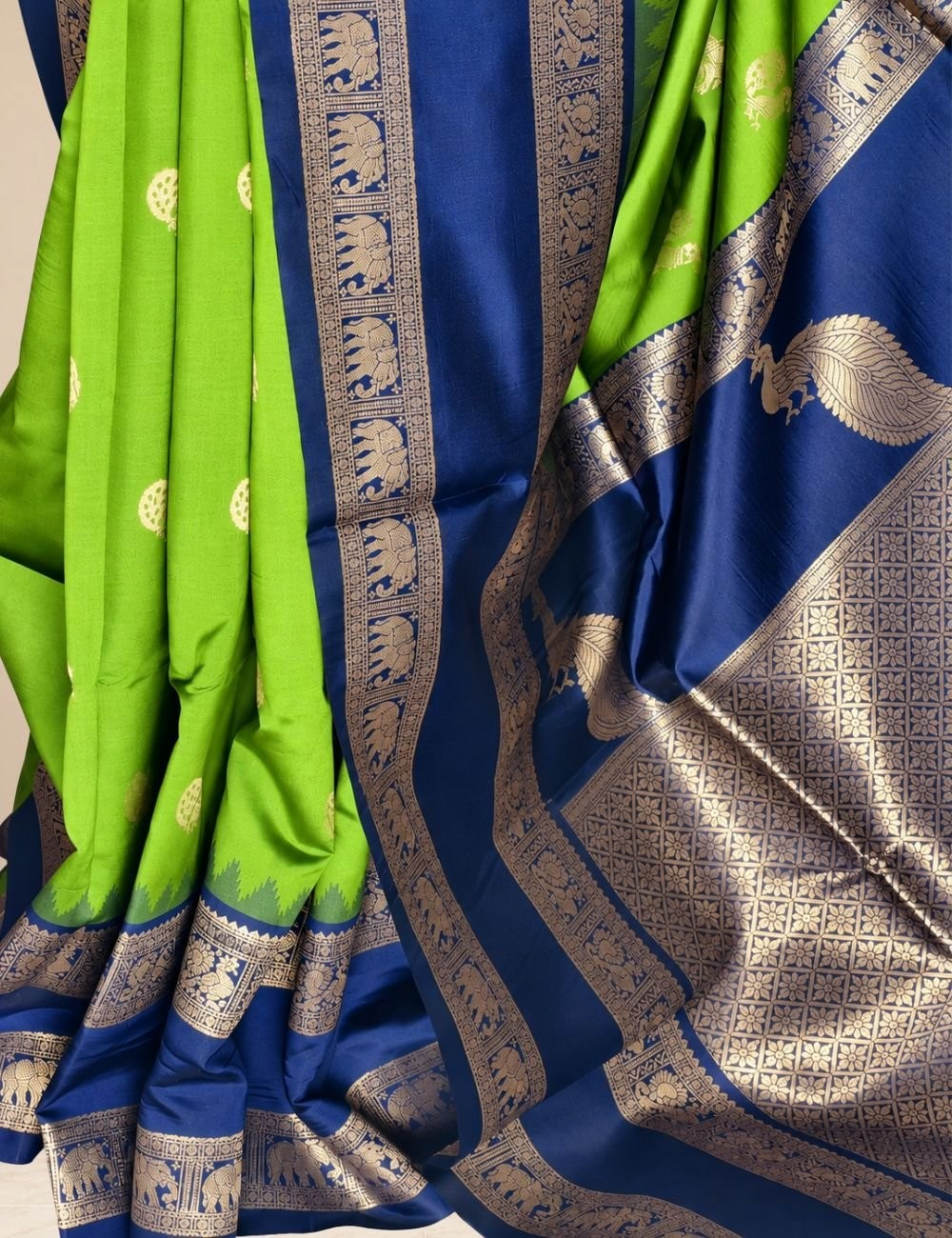 House Of Paramya parrot green semi soft silk saree with navy blue elephant border and peacock zari pallu