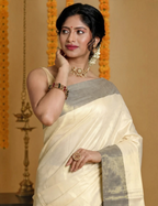House Of Paramya ivory pure cotton Kasavu saree featuring a sea green border with gold zari accents on a model