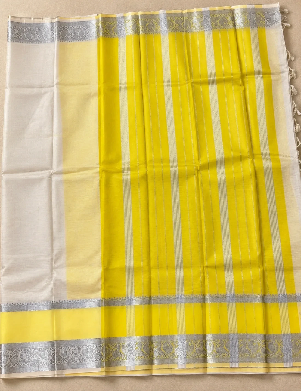 House Of Paramya ivory white Mangalagiri Pattu saree featuring a bold yellow border with silver zari nizam stripes.