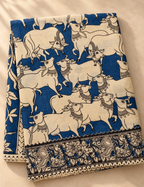 House Of Paramya beige and indigo mul cotton saree featuring hand-painted Kalamkari Pichwai cow motifs and border.