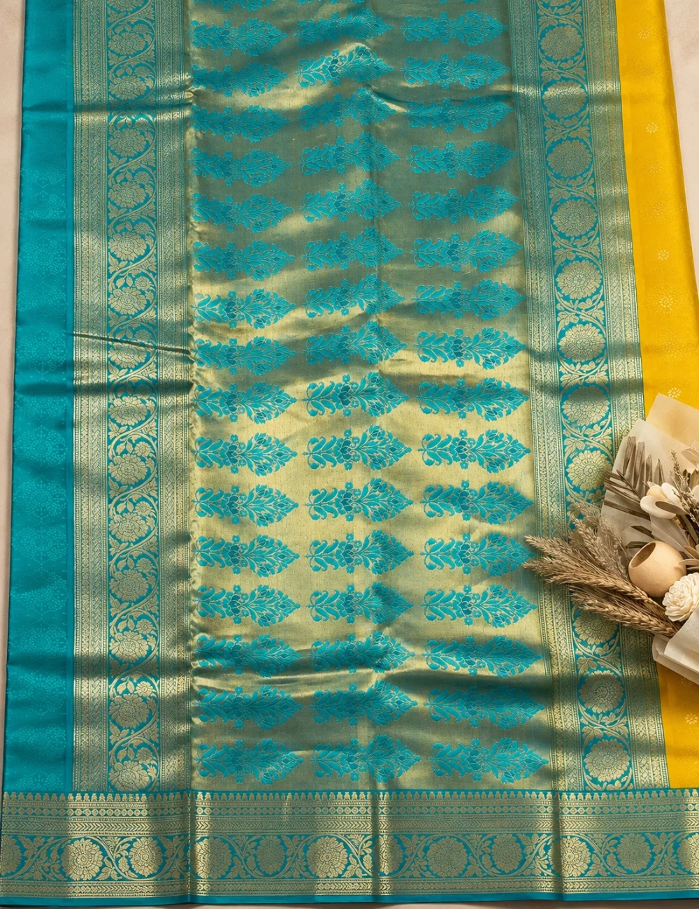 House Of Paramya mustard yellow and turquoise blue Kanchipuram silk saree with intricate gold zari floral buttas