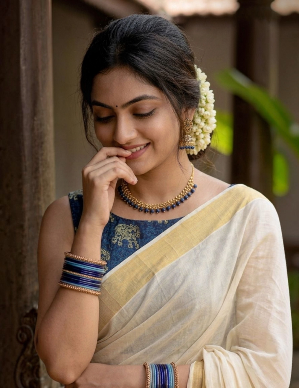 House Of Paramya cream cotton Kasavu saree with navy Ajrakh elephant print and traditional gold zari border