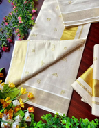 House Of Paramya off-white tissue silk Kasavu saree featuring gold Malayalam script Aksharamala motifs and border.