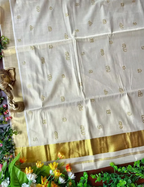House Of Paramya off-white tissue silk saree with gold Kasavu border and intricate Malayalam script Aksharamala print