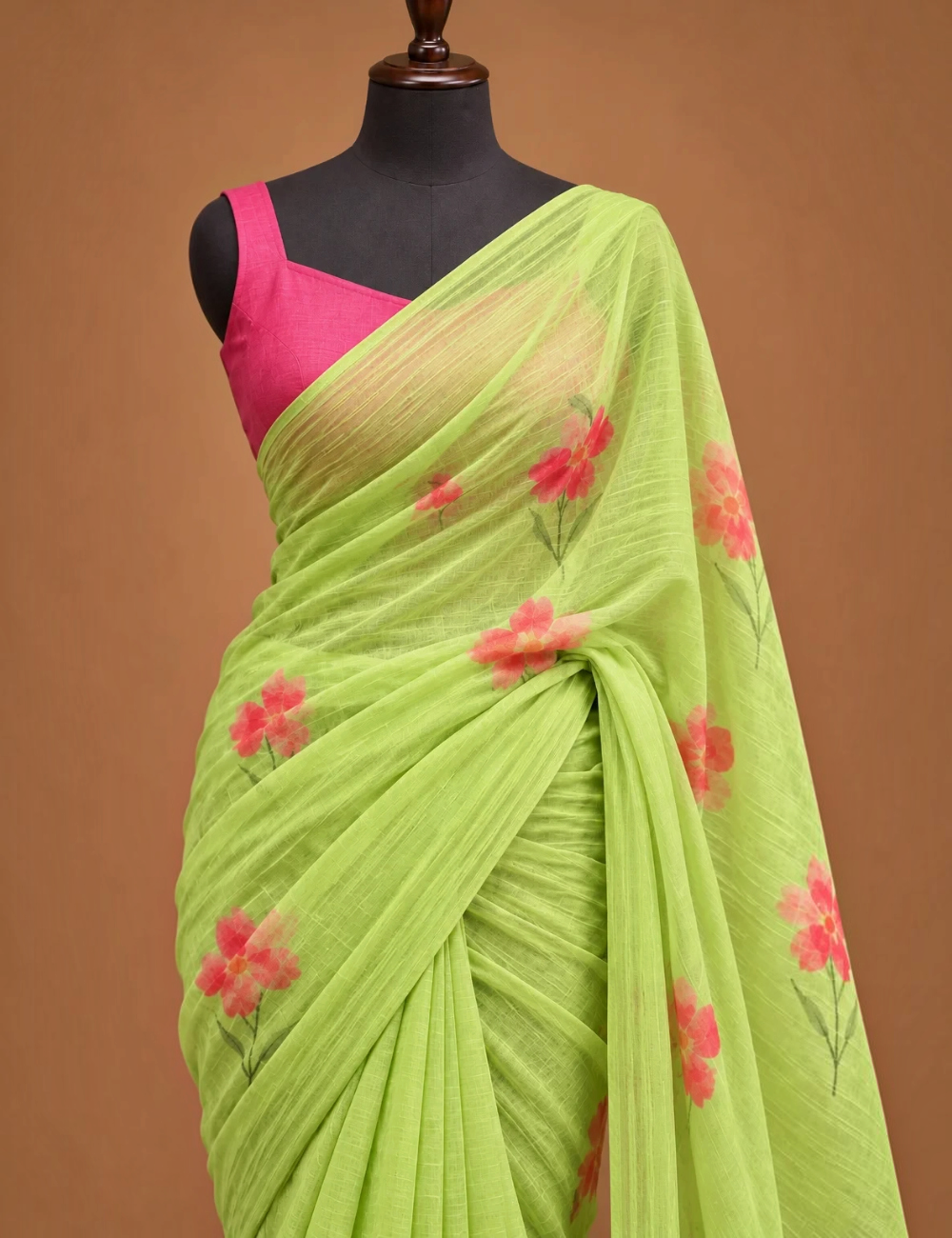 House Of Paramya lime green linen cotton saree with coral floral prints and a dark green gold border on a mannequin