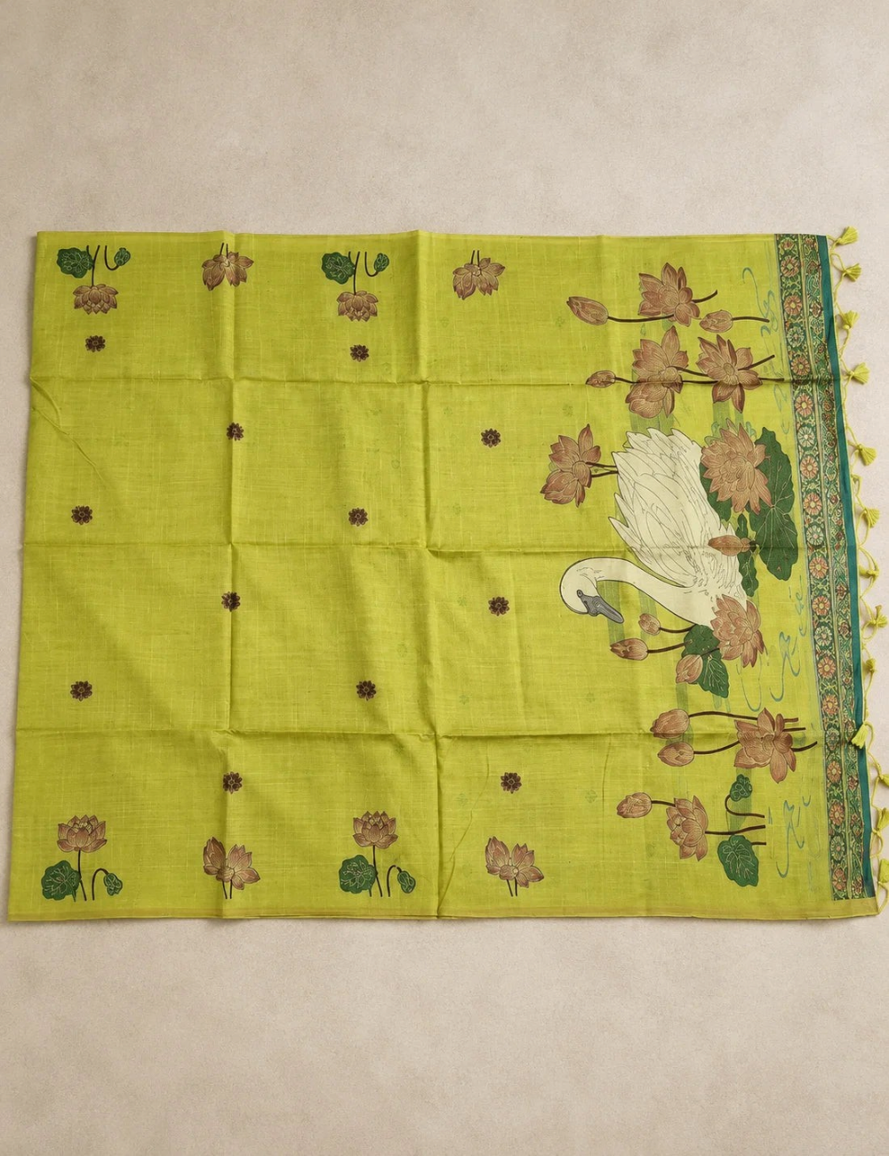 House Of Paramya lime green tussar silk cotton saree featuring woven lotus motifs and a swan pond pallu with tassels.