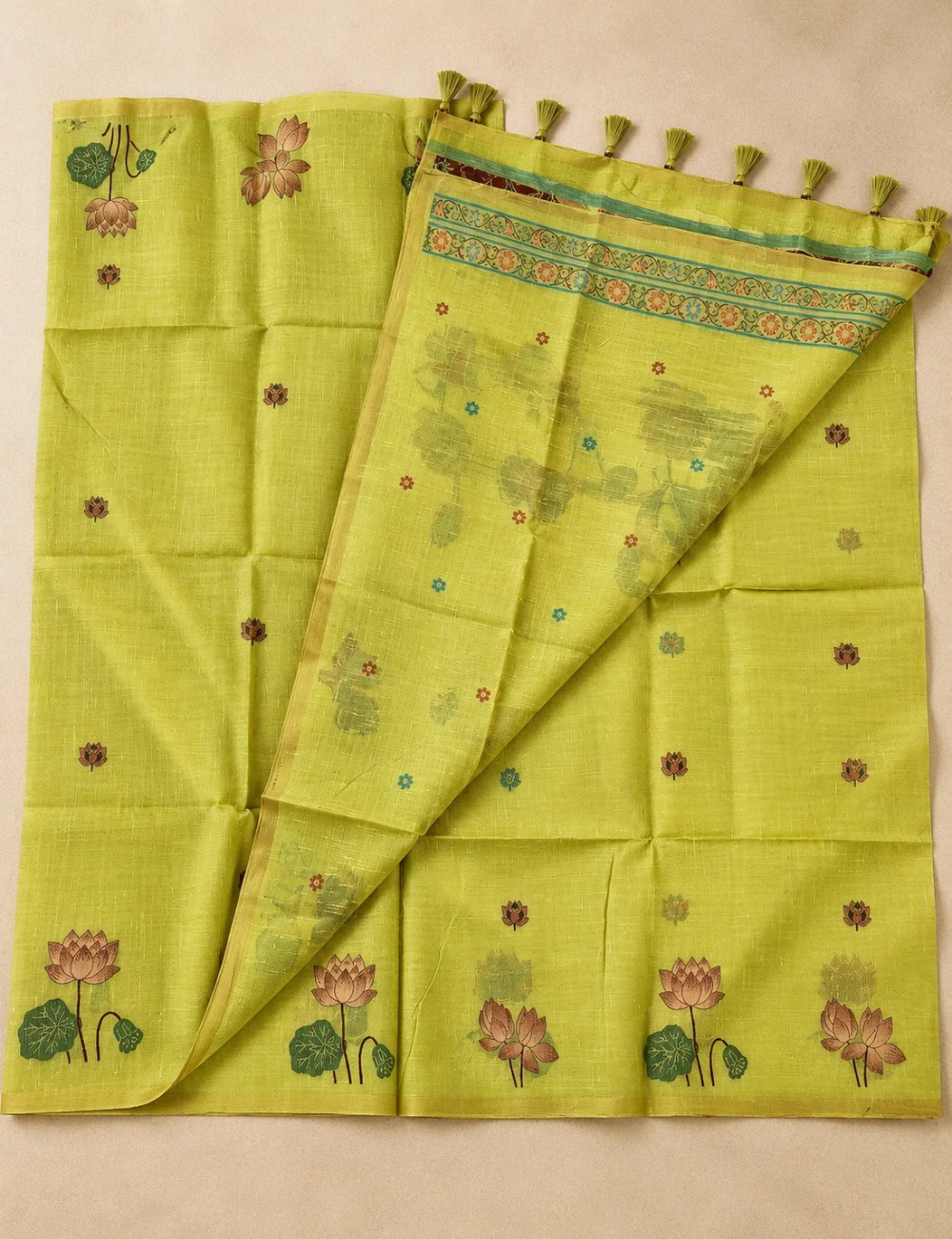 House Of Paramya lime green tussar silk cotton saree featuring woven lotus and swan motifs with a tassel pallu.