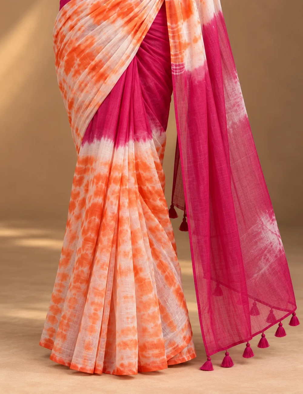 House Of Paramya linen cotton saree featuring an orange and white shibori tie-dye print with a magenta color block.