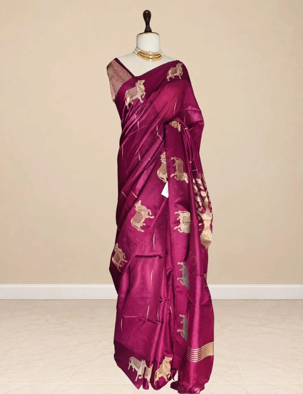 House Of Paramya deep magenta raw tussar silk saree featuring woven gold zari Pichwai cow motifs and striped pallu.