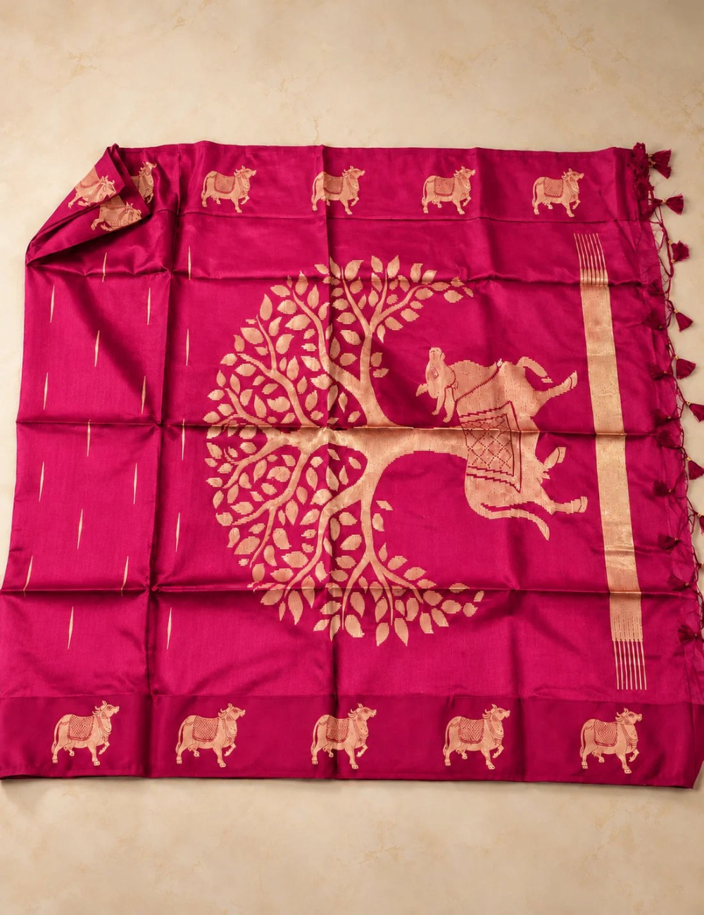 House Of Paramya magenta raw tussar silk saree featuring large gold zari tree and cow motifs with tassel pallu