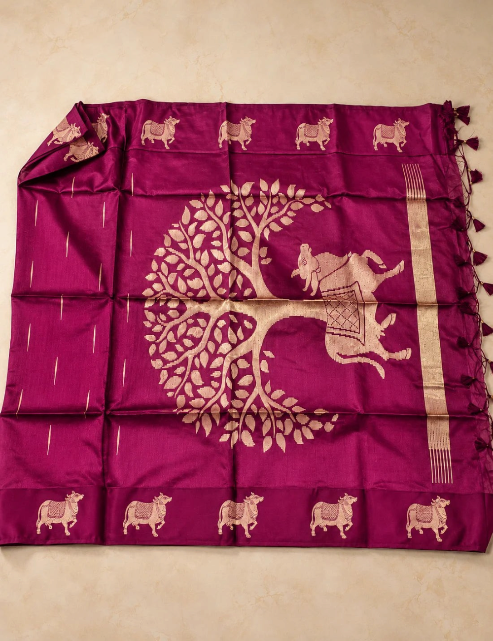 House Of Paramya deep magenta raw tussar silk saree featuring large woven gold zari Pichwai cow and tree motifs